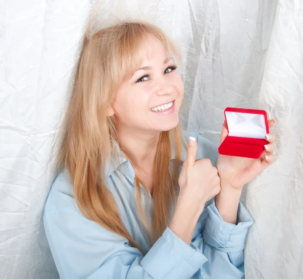 Beautiful woman in man shirt with red gift box with jewellery — Stock Photo, Image