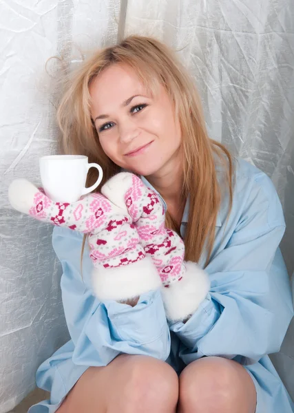 Woman in man shirt with warm wool socks with hearts — Stock Photo, Image