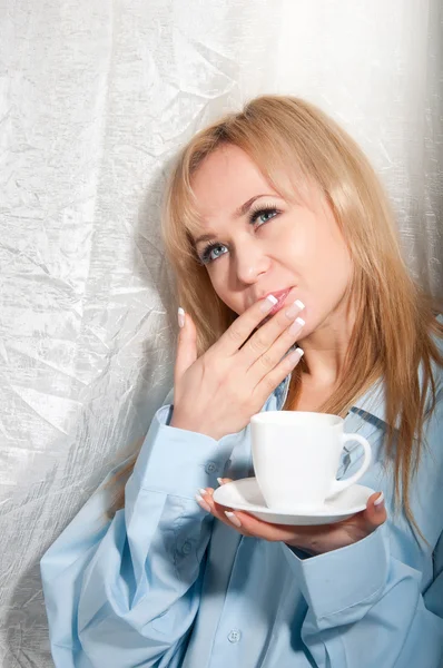 Alluring sexy woman in man boyfriend shirt at home with coffee at morning. — Stock Photo, Image