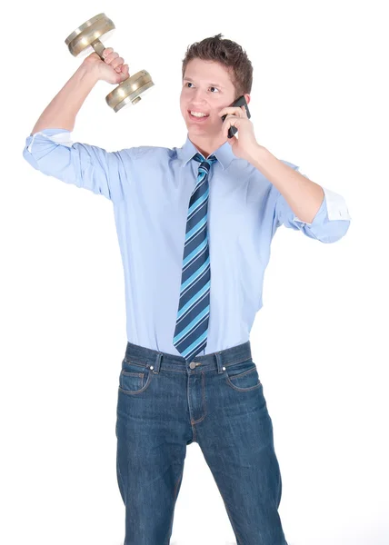 Young business man with dumbbell speaking on a phone — Stock Photo, Image