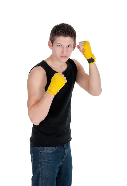 Gezonde man een punch gooien en het dragen van de opleiding loopt op een witte achtergrond — Stockfoto