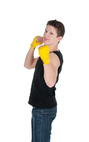 Healthy man throwing a punch and wearing training wraps on a white background — Stock Photo, Image