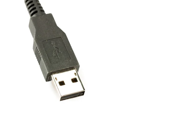 Macro de un cable USB negro sobre fondo blanco — Foto de Stock