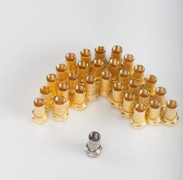 Golden F connectors and one silver connector — Stock Photo, Image