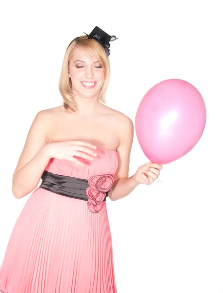 Porträt einer Frau in rosa Kleid mit Luftball — Stockfoto