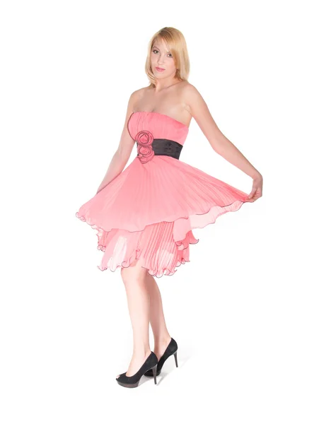 Танцующая женщина в розовом платье — стоковое фото