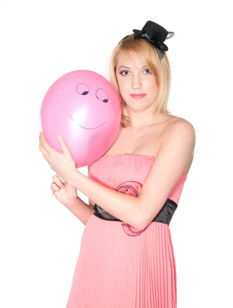 Portret van een womanl in roze jurk met lachende air bal — Stockfoto