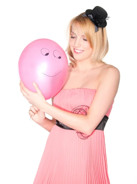 Retrato de una mujer en vestido rosa con bola de aire sonriente —  Fotos de Stock