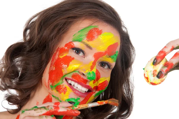 Happy young woman painting Easter eggs — Stock Photo, Image