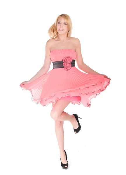 Dancing woman in pink dress — Stock Photo, Image