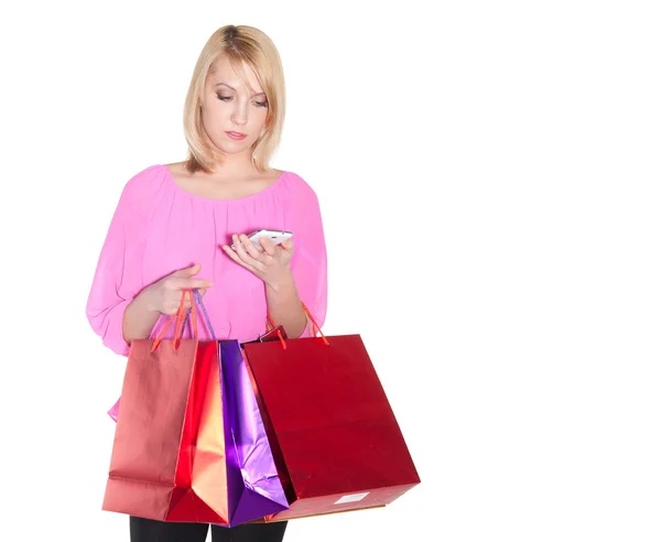 Blonde vrouw met shopping tassen — Stockfoto