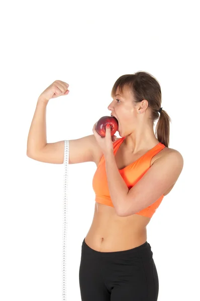 Young beautiful woman after fitness time and exercising with red apple — Stock Photo, Image