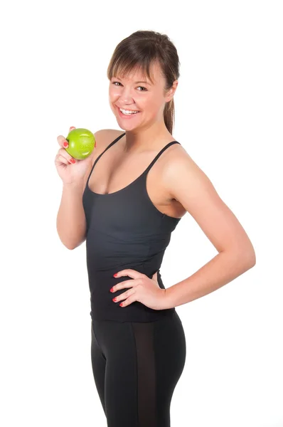 Hermosa joven deportista con manzana verde, aislado en blanco — Foto de Stock