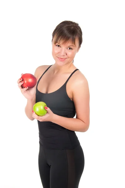 Hermosa mujer deportiva joven con manzana roja y verde, aislada en blanco — Foto de Stock