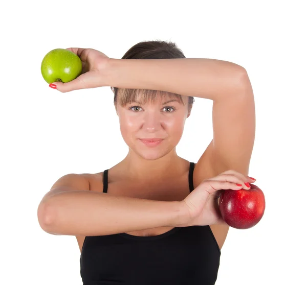 Hermosa mujer deportiva joven con manzana roja y verde, aislada en blanco — Foto de Stock