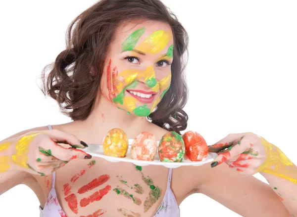 Happy young woman painting Easter eggs — Stock Photo, Image