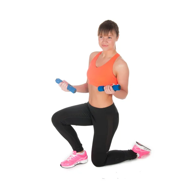 Fitness woman exercising with dumpbells — Stock Photo, Image