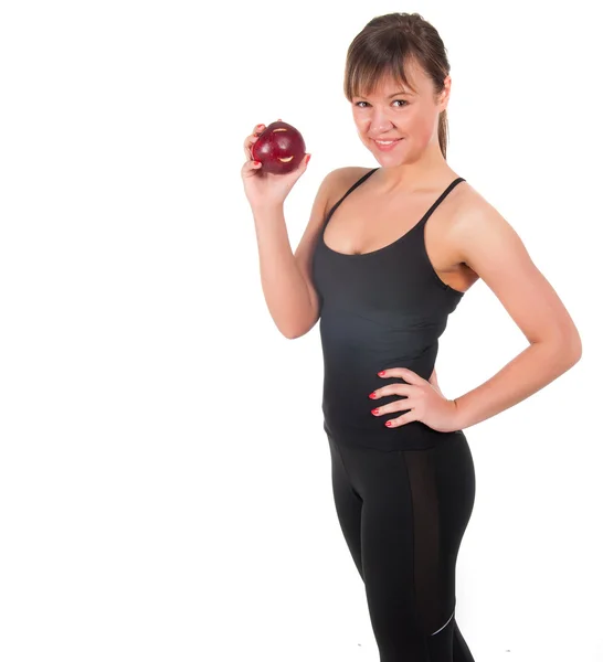 Красивая молодая спортсменка с красным яблоком, изолированная на белом — стоковое фото