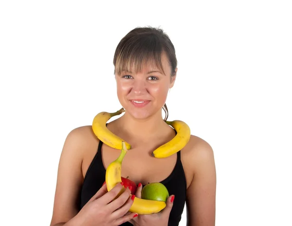 Beautiful fitness young woman with bananas and apples. — Stock Fotó