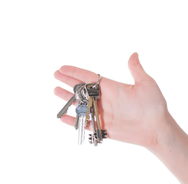 Hand with keys isolated on white — Stock Photo, Image