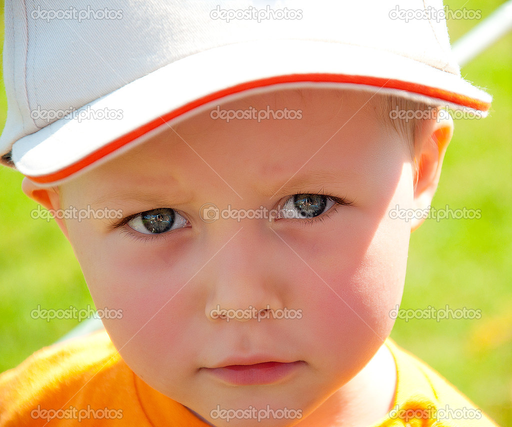 Adorable little boy portrait with cap