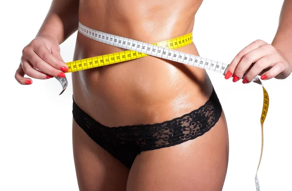 Žena měření dokonalý tvar zdravá krásná stehna. — Stock fotografie