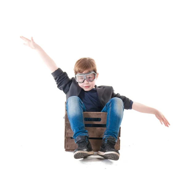 Young boy pilot flying a wood box — Stock Photo, Image