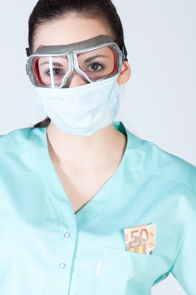 Nurse or doctor in pilot glasses with mask and money — Stock Photo, Image