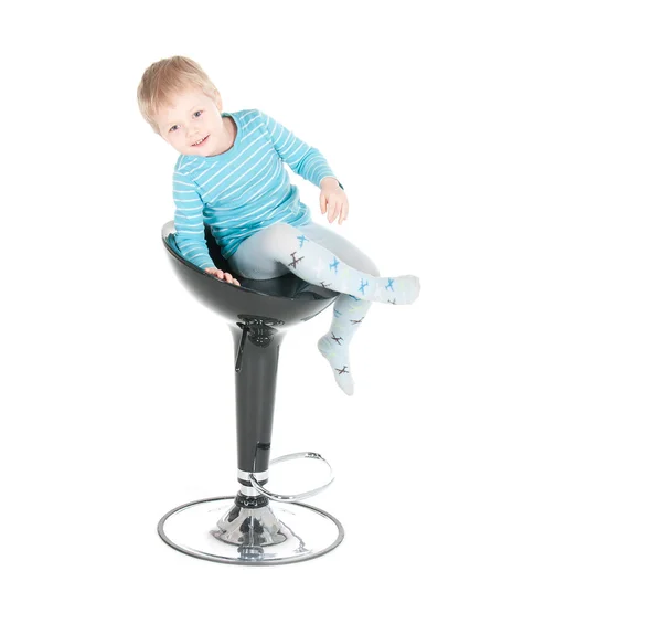 Little boy sitting in a chair — Stock Photo, Image