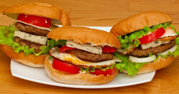 Tasty homemade burger on a plate — Stock Photo, Image