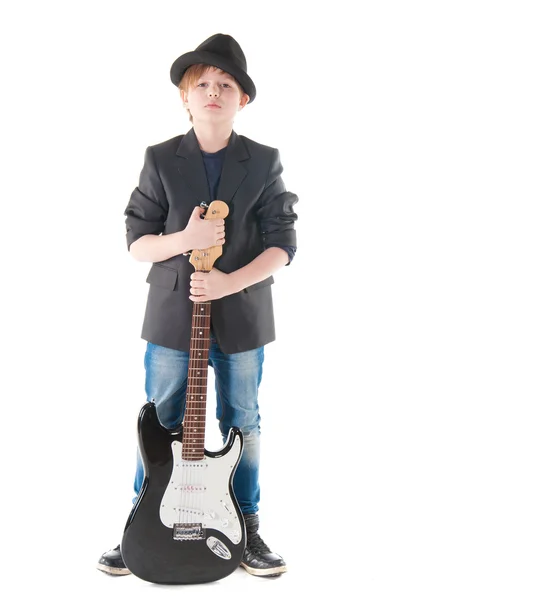 Menino bonito com guitarra elétrica posando — Fotografia de Stock