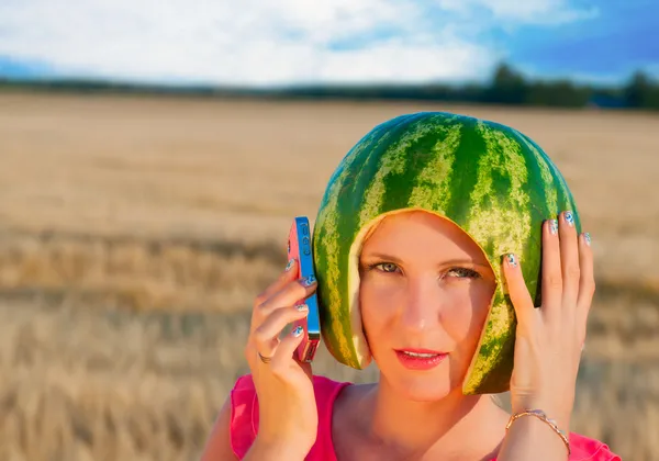 Portrait of beautiful sexy young woman model with water-melon on head — Stock Photo, Image
