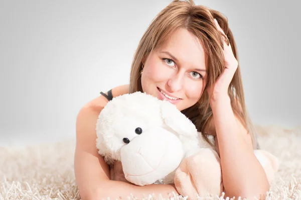 Beautiful young blond woman wearing pajamas — Stock Photo, Image