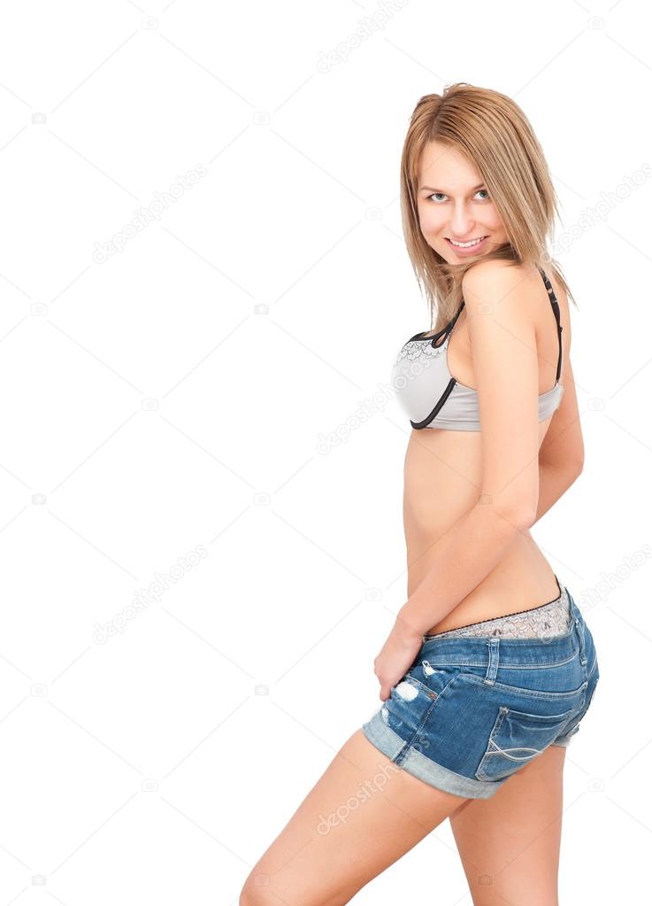 Sexy woman posing in jeans shorts and underwear Stock Photo by
