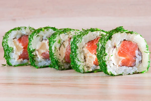 Maki Sushi on wooden background — Stock Photo, Image