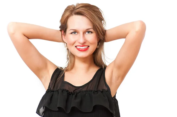 Una hermosa mujer posando y sonriendo coqueta —  Fotos de Stock