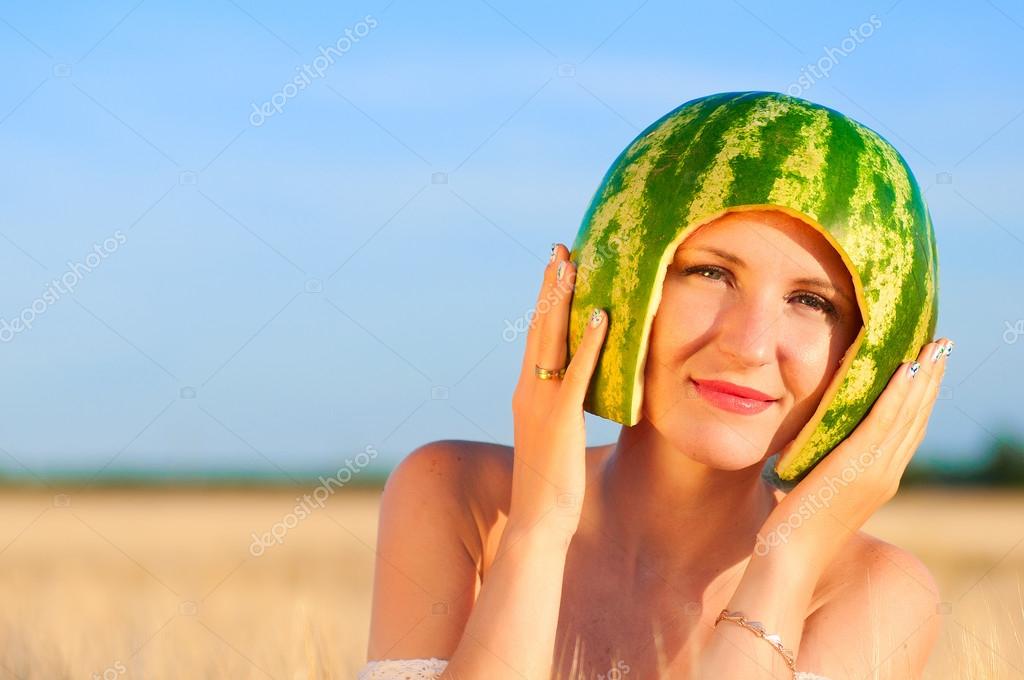 Woman model with watermelon on head Stock Photo by ©DeathLess 43721877
