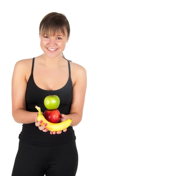 Fitness mujer joven con plátanos y manzanas . — Foto de Stock