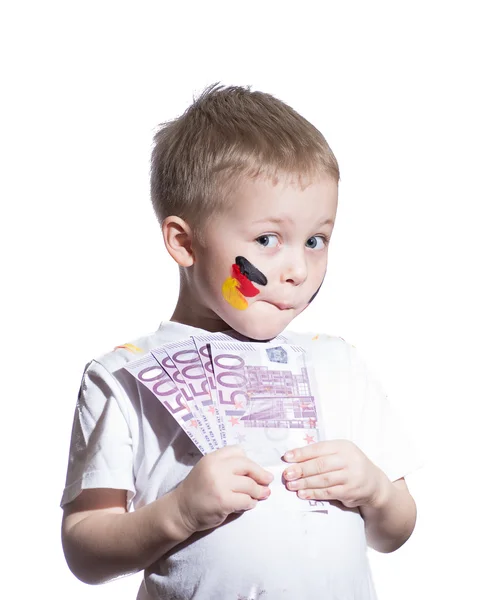 Ładny chłopiec z euro moneyl i flagi na jego policzkach — Zdjęcie stockowe