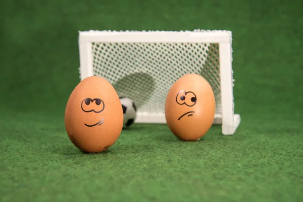 Funny eggs and football. goal and envy egg — Stock Photo, Image
