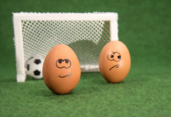 Funny eggs and football. goal and envy egg — Stock Photo, Image