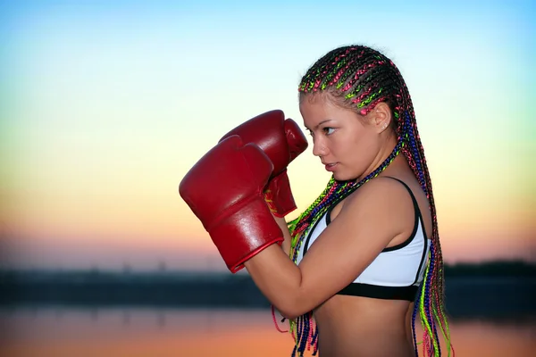 Portrait of a girl with red boxing gloves — Stock Photo, Image