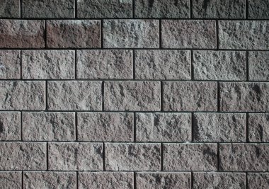 Taş zemin dokusunun arka planı. Taşlar asfaltlanmış, yol fayanslarla döşenmiş..