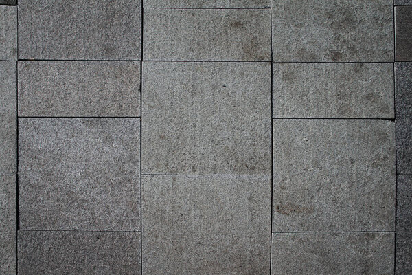 Background of stone floor texture. Paving stones, the road is paved with tiles.