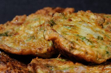 Vegetable pancakes from zucchini just baked closeup. Shallow depth of field