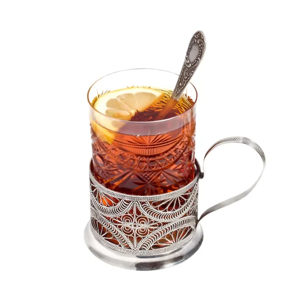 Tea glass with a lemon in a glass-holder — Stock Photo, Image