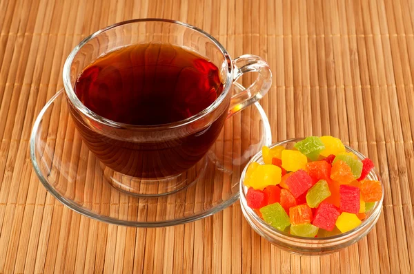 Cup of tea with candied fruits — Stock Photo, Image