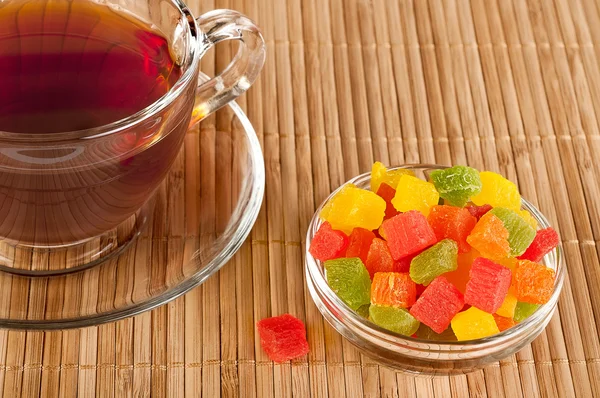 Cup of tea with candied fruits — Stock Photo, Image