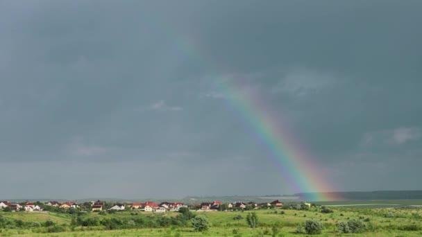 Bright Rainbow Rises Meadow Sky Outskirts Village Clouds Background — Stockvideo