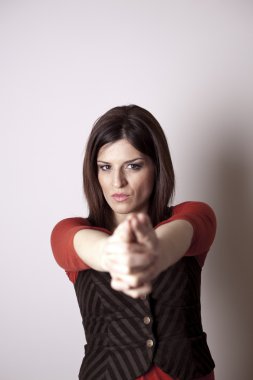 Young female pointing at you.